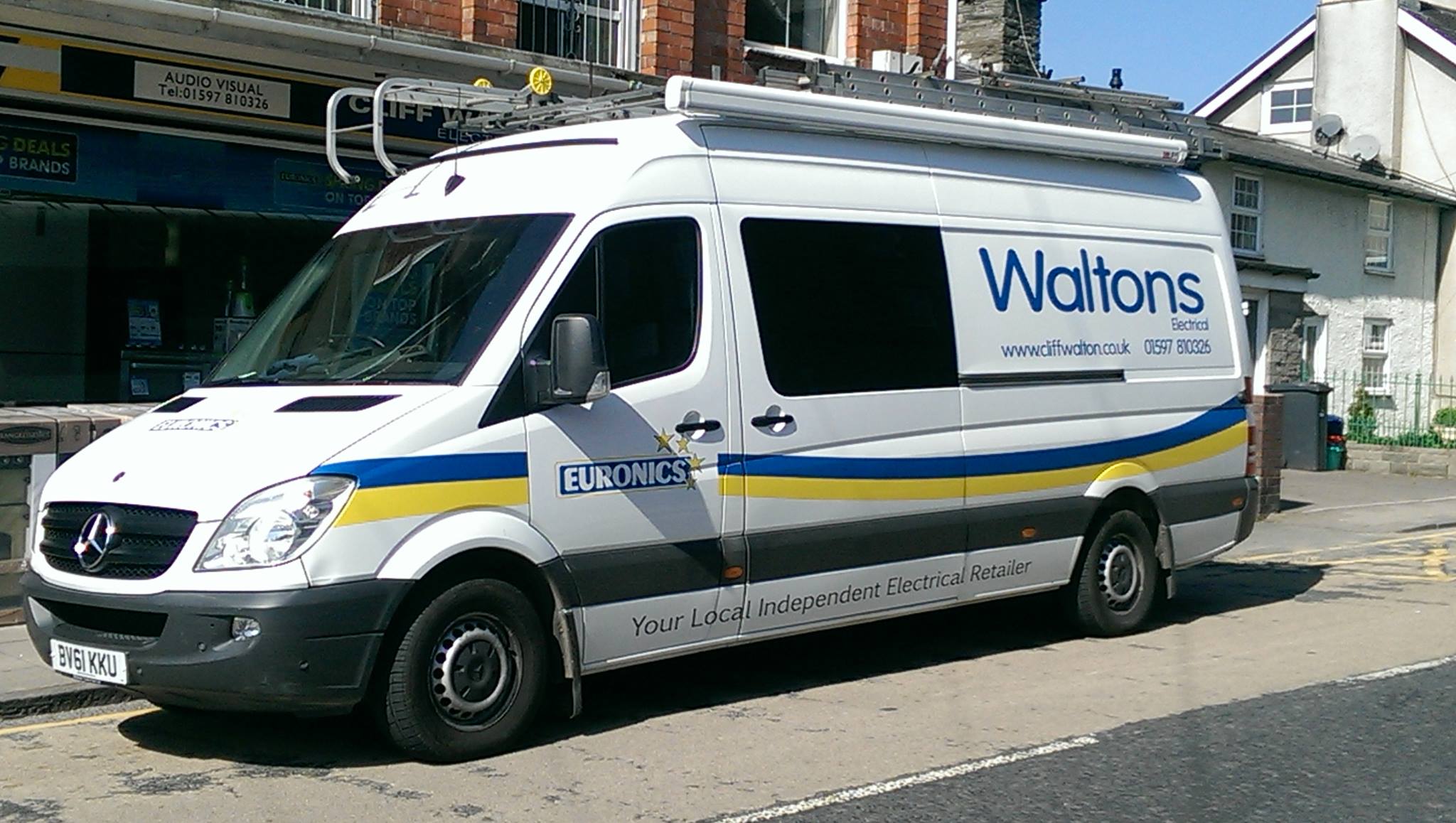 Cliff Walton van parked up in front of shop front.